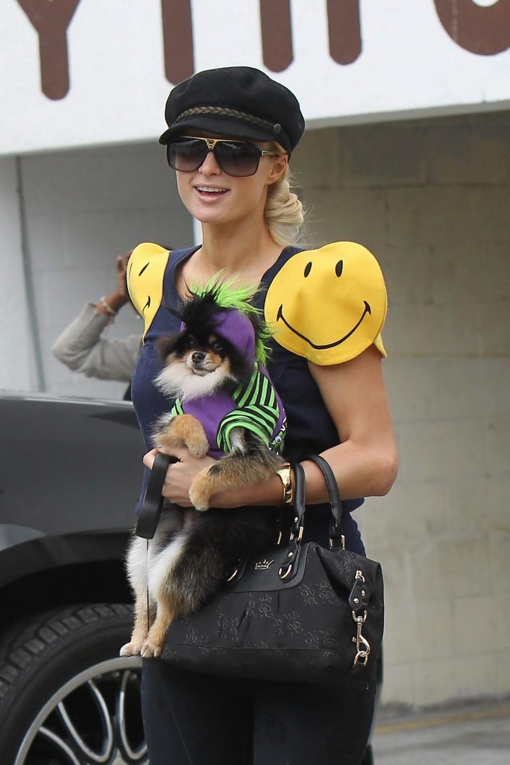 16P Paris Hilton showing off her ass in see-through tights while shopping
