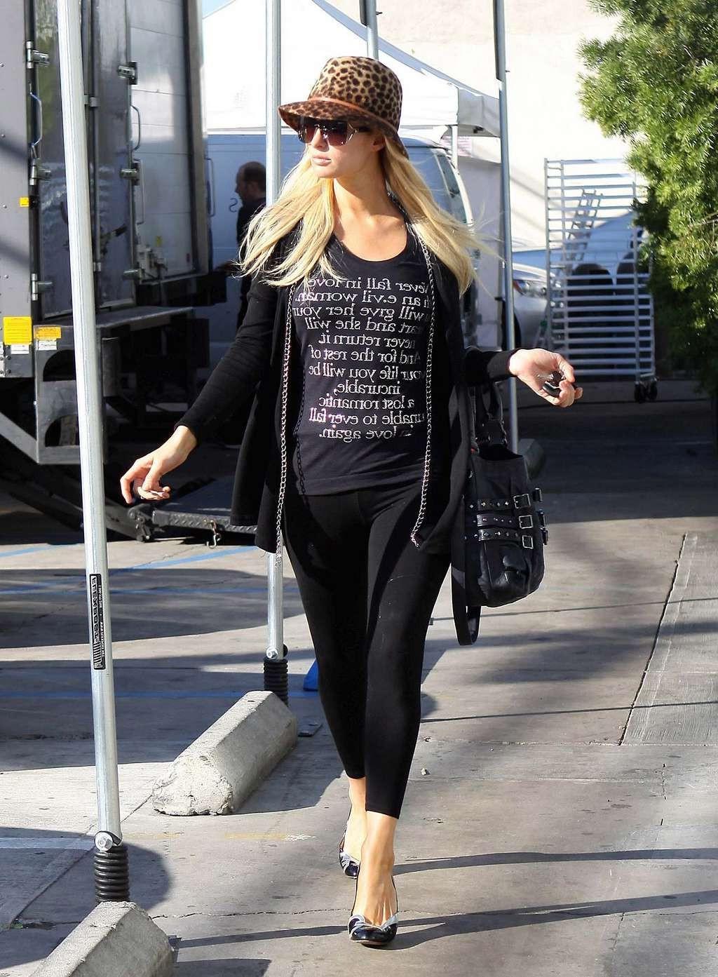 10P Paris Hilton in see thru leggings flashing her ass on street paparazzi pictures