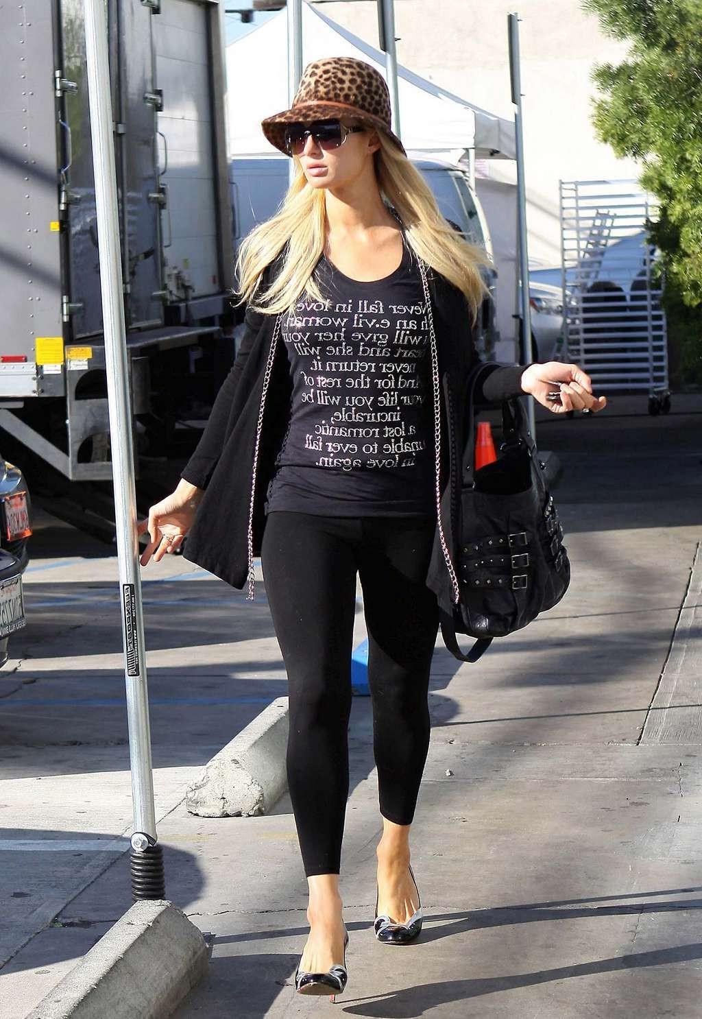 10P Paris Hilton in see thru leggings flashing her ass on street paparazzi pictures