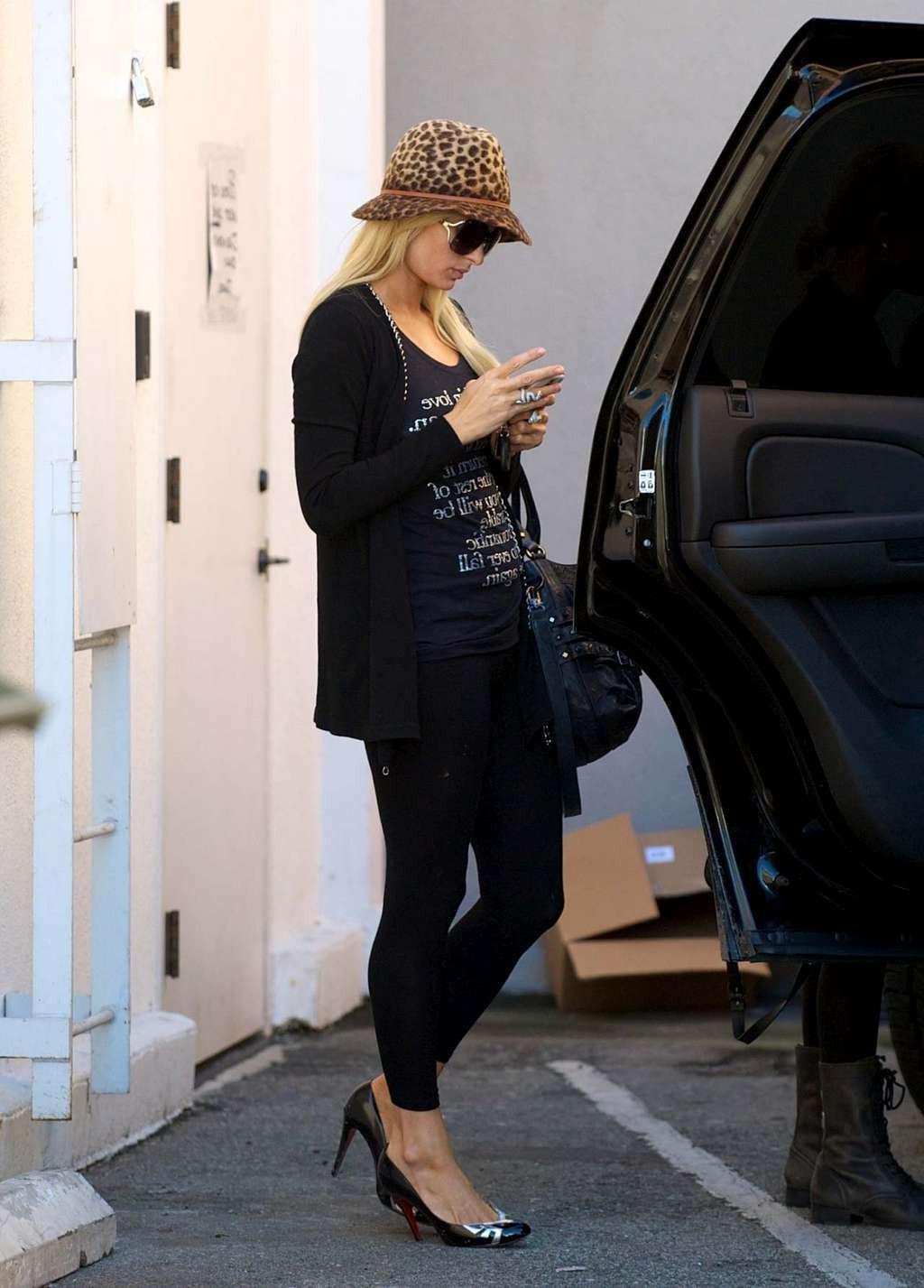 10P Paris Hilton in see thru leggings flashing her ass on street paparazzi pictures