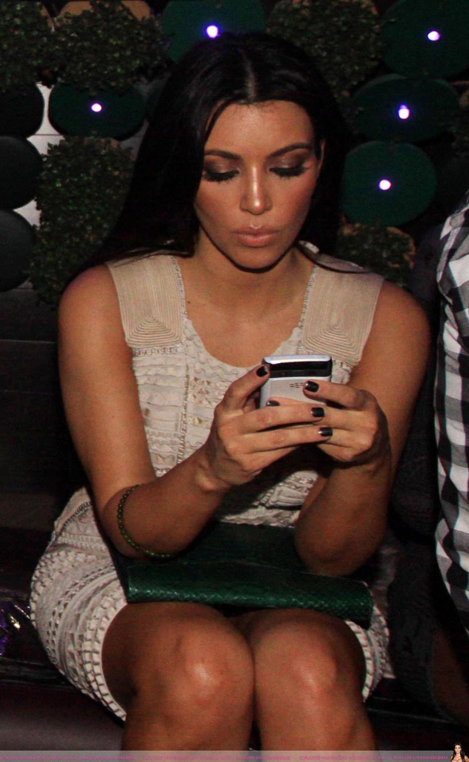 16P Kim Kardashian exposing sexy body and huge boobs in see thru blouse