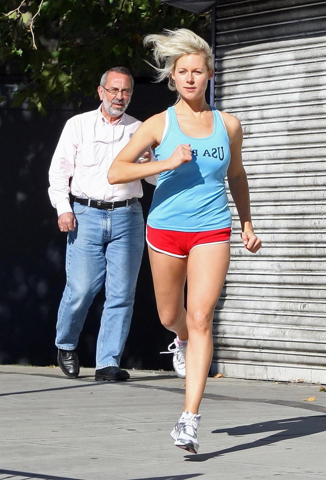 16P Abi Titmuss in shorts  tank-top jogging  stretching on the streets of London