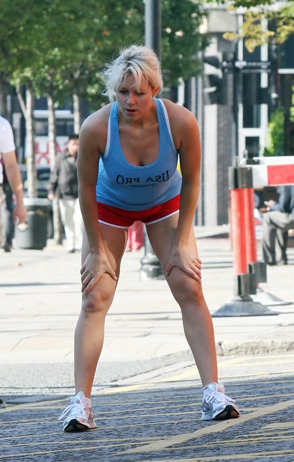 16P Abi Titmuss in shorts  tank-top jogging  stretching on the streets of London