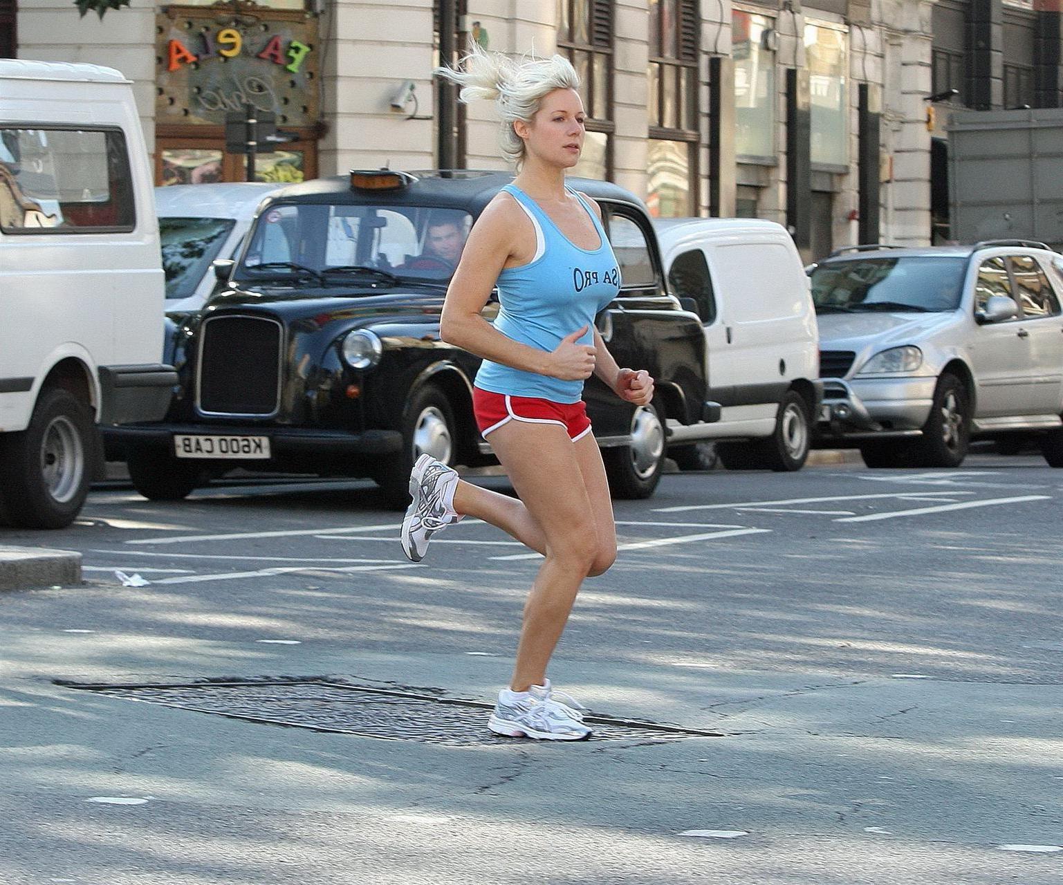 16P Abi Titmuss in shorts  tank-top jogging  stretching on the streets of London