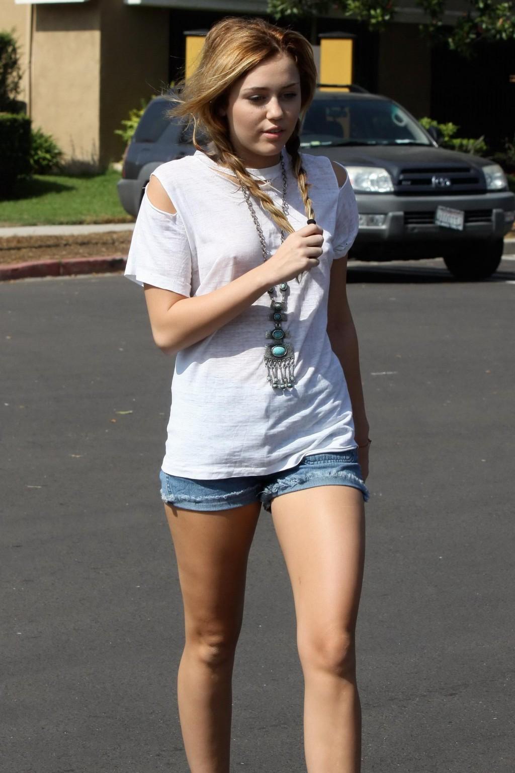 16P Miley Cyrus braless wearing see-through T-shirt in Toluca Lake