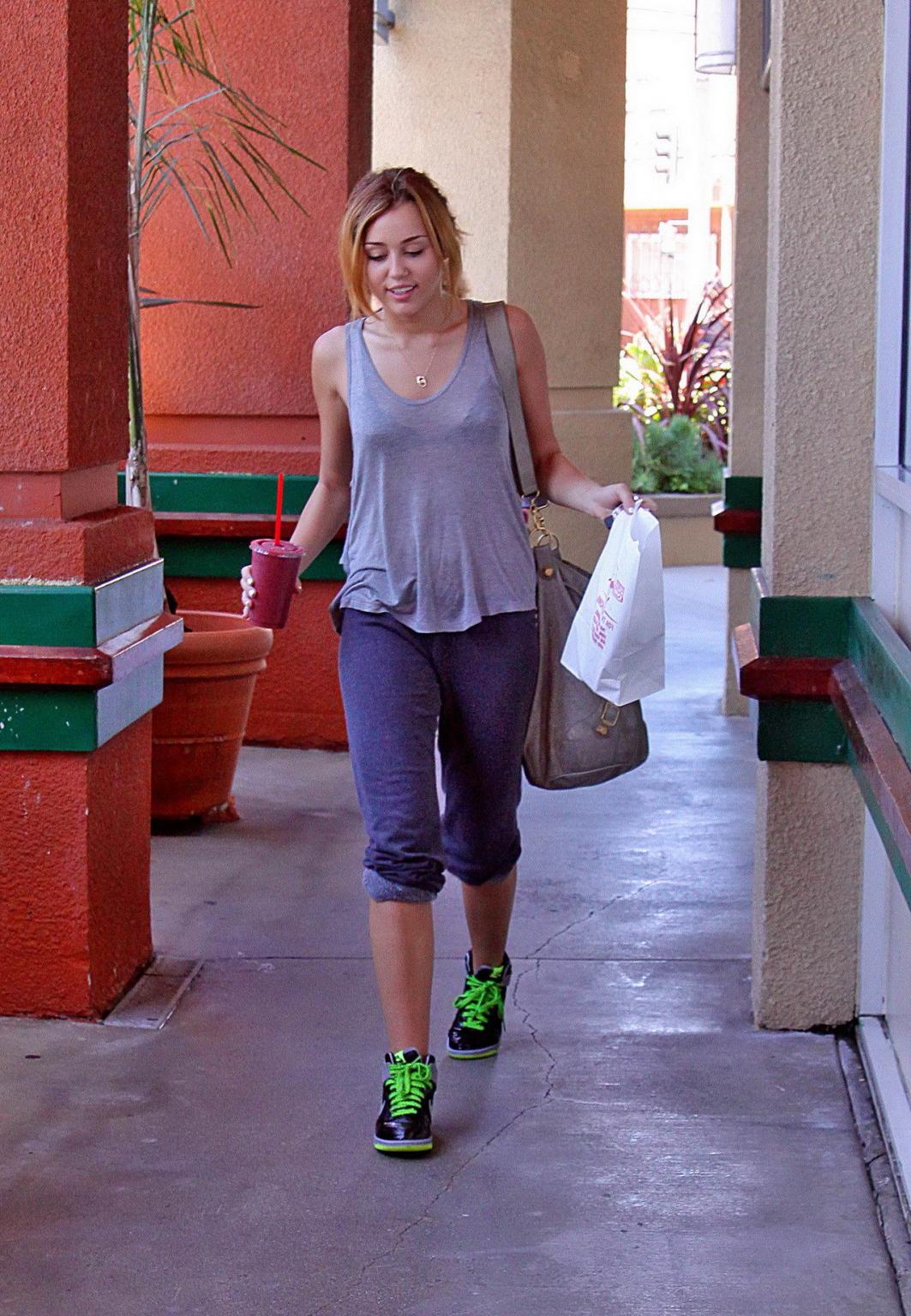 16P Miley Cyrus in black bra  see-through top at Erewhon Natural Foods grocery store