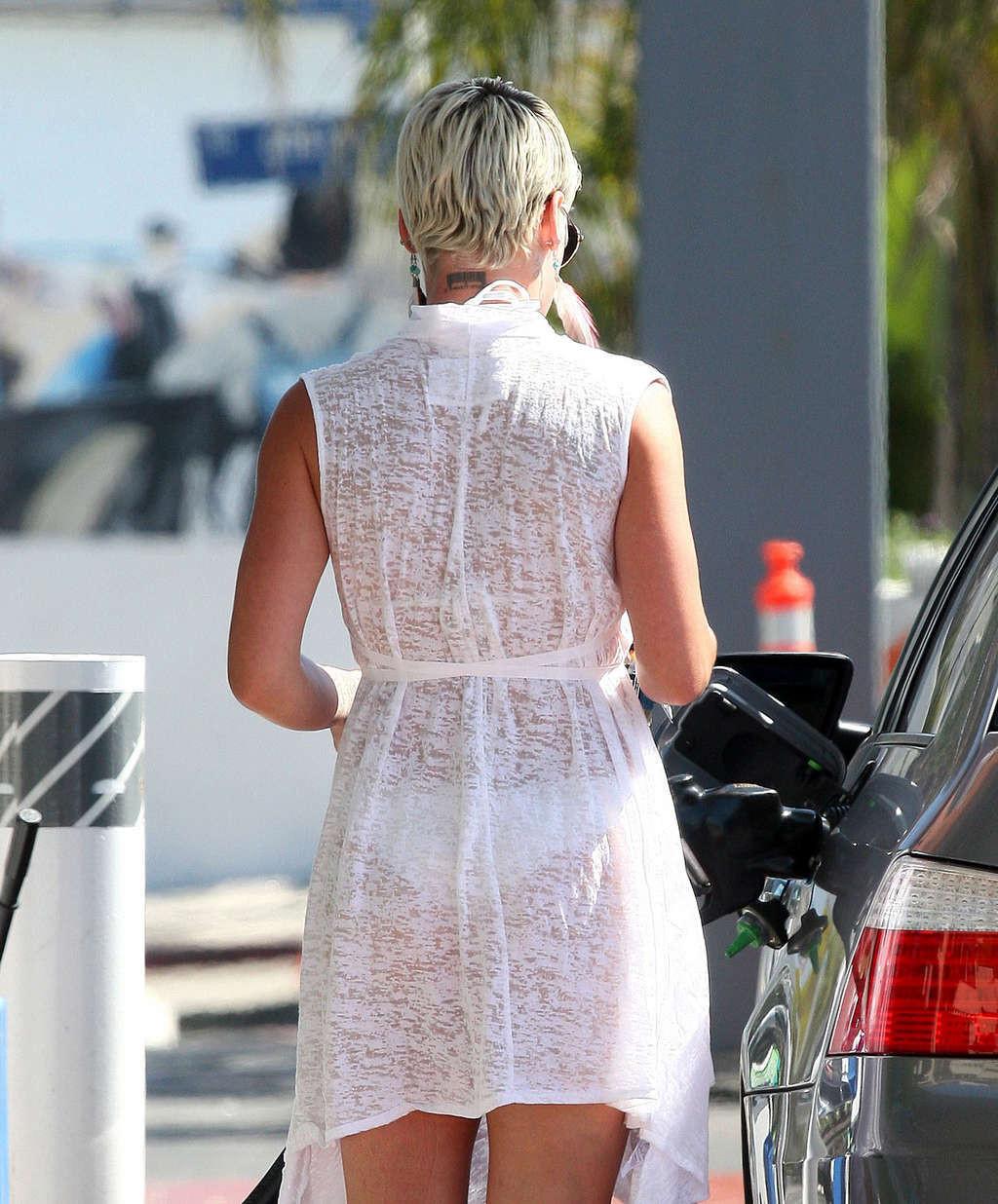 16P Pink exposing her sexy body and hot ass in see thru dress at gas station
