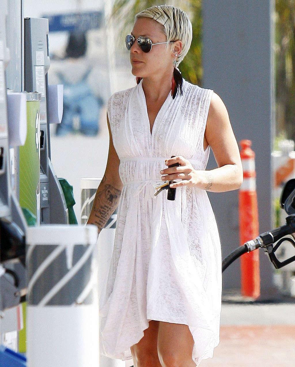 16P Pink exposing her sexy body and hot ass in see thru dress at gas station