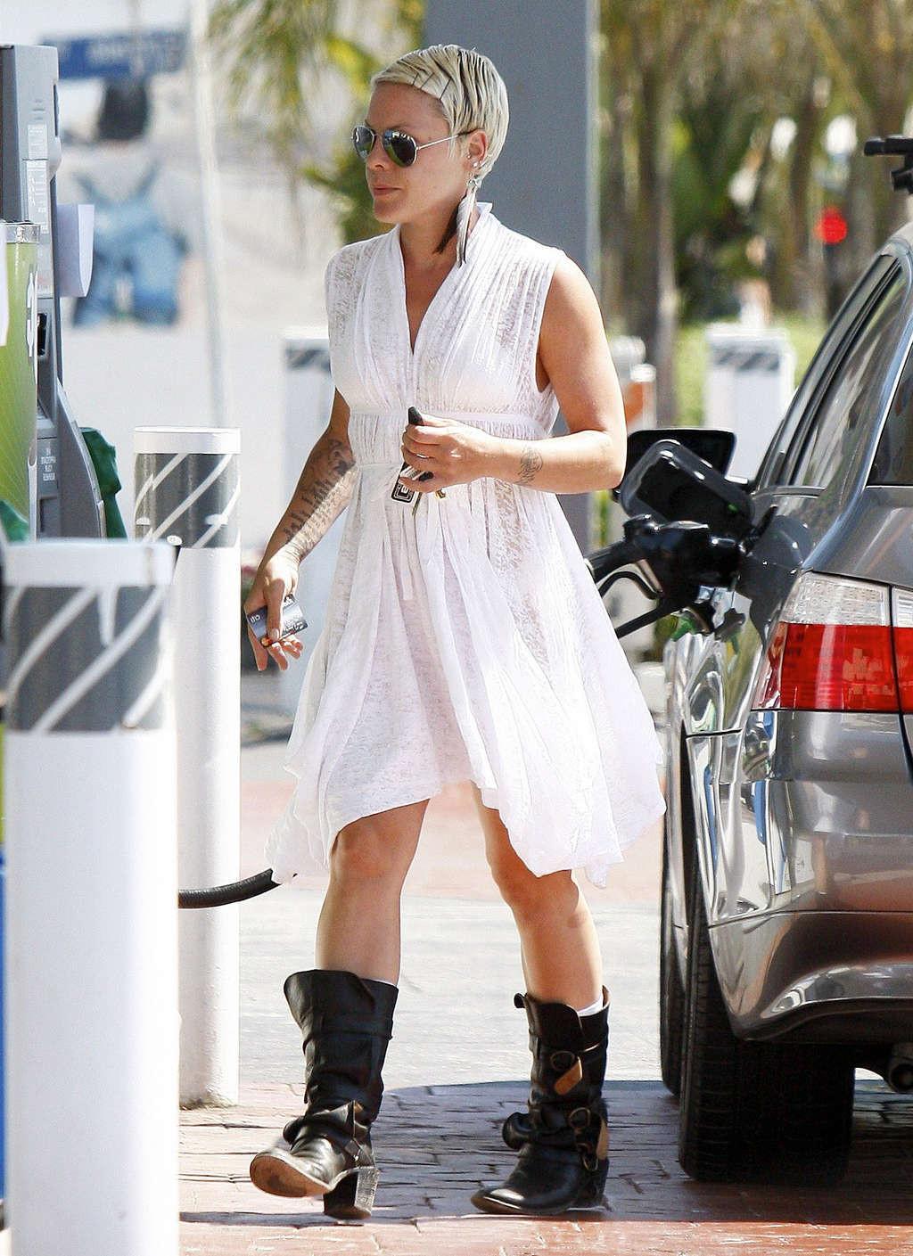 16P Pink exposing her sexy body and hot ass in see thru dress at gas station