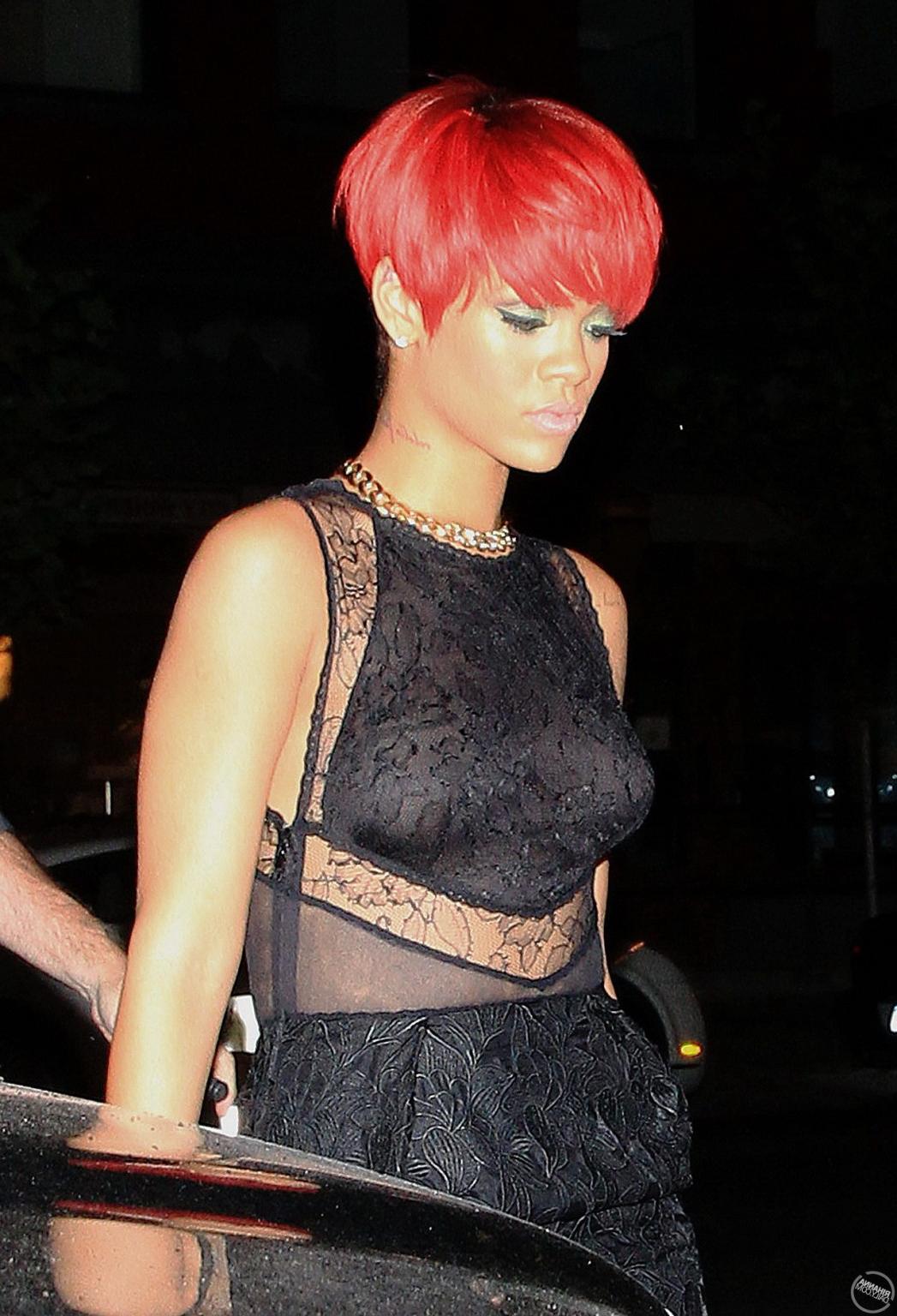 15P Rihanna showing off her boobs in black see-through dress