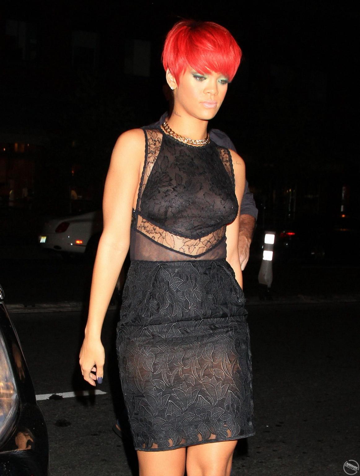 15P Rihanna showing off her boobs in black see-through dress