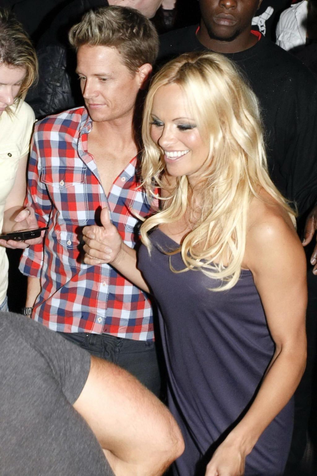 15P Busty Pamela Anderson braless wearing slightly see through gown at the Silk Road