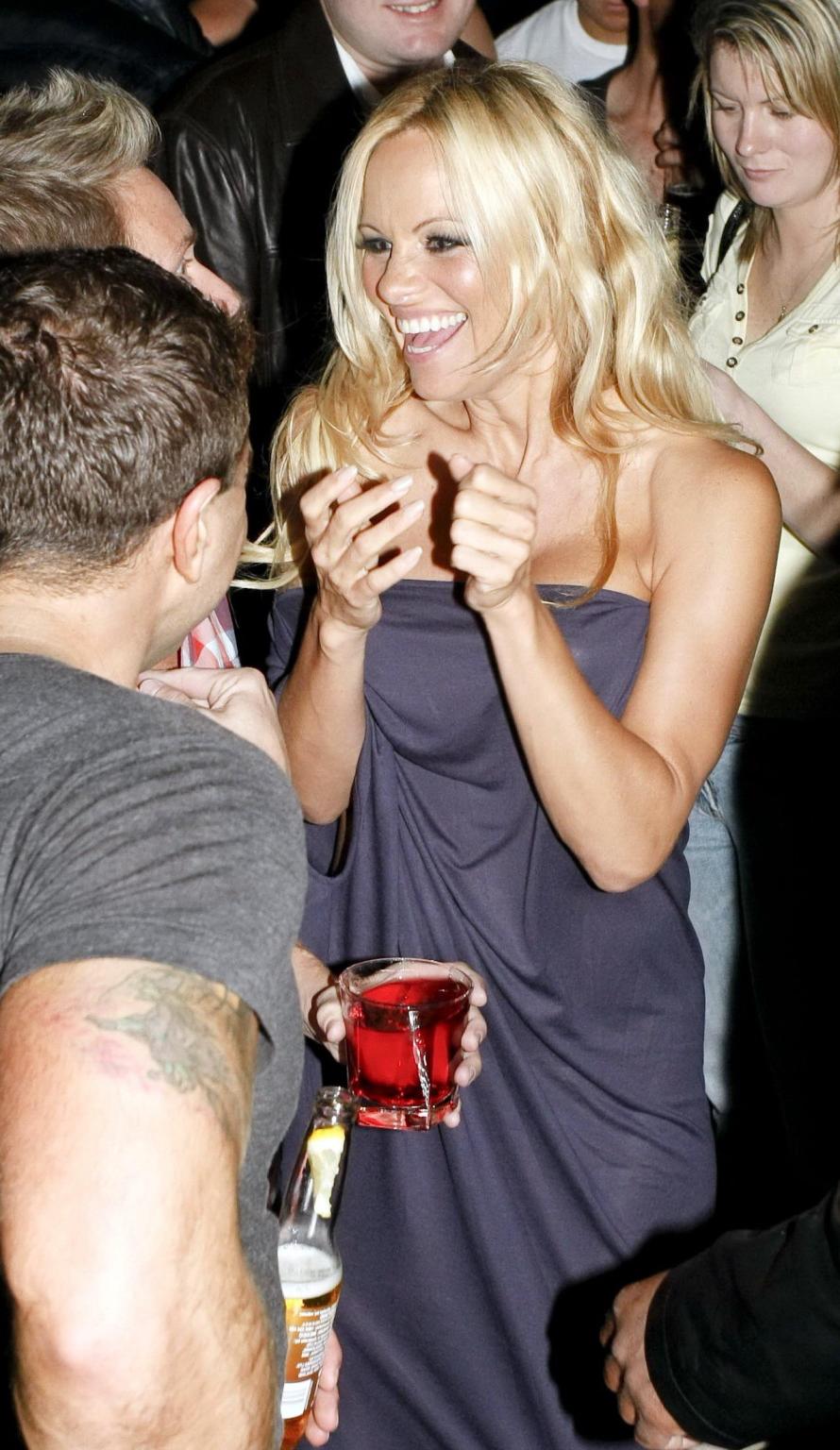 15P Busty Pamela Anderson braless wearing slightly see through gown at the Silk Road