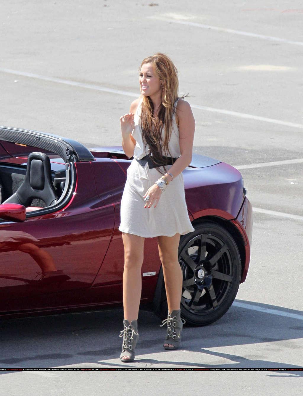 16P Miley Cyrus in thong and see thru dress and almost upskirt