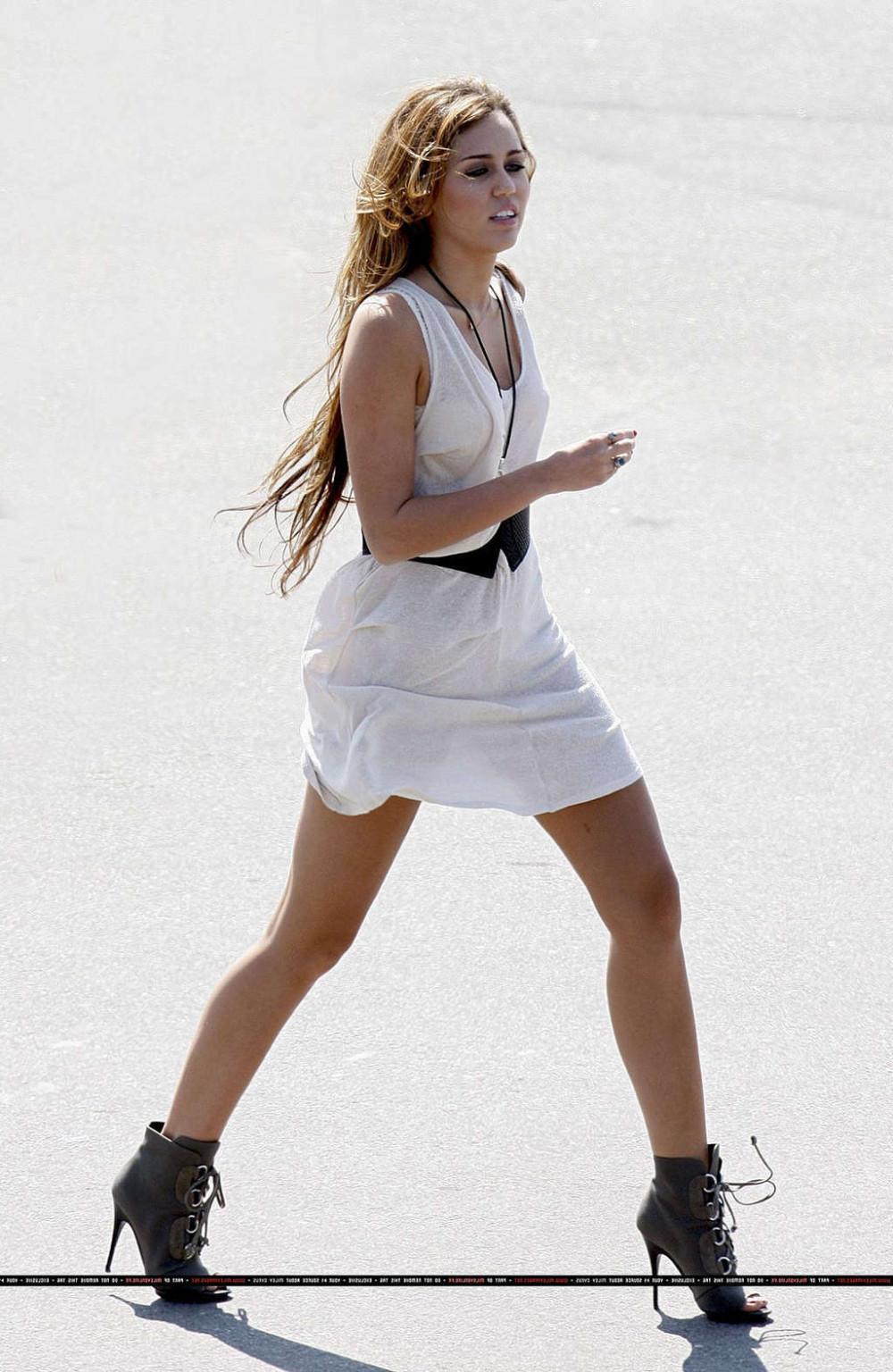 16P Miley Cyrus in thong and see thru dress and almost upskirt