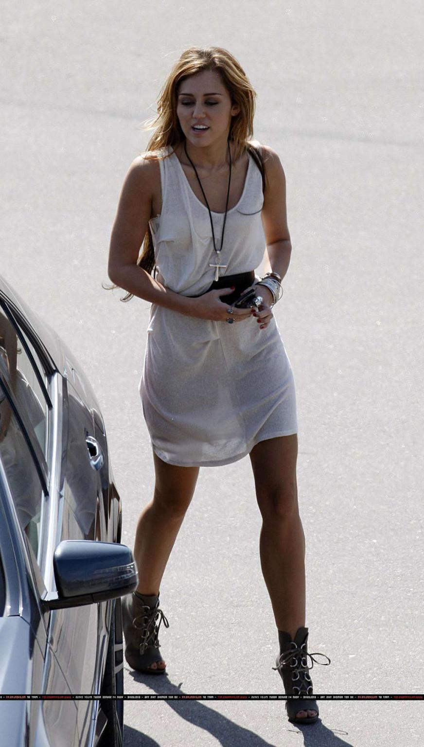 16P Miley Cyrus in thong and see thru dress and almost upskirt