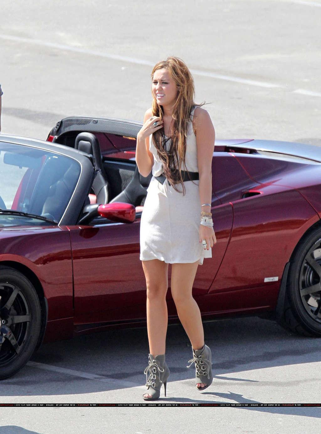 16P Miley Cyrus in thong and see thru dress and almost upskirt