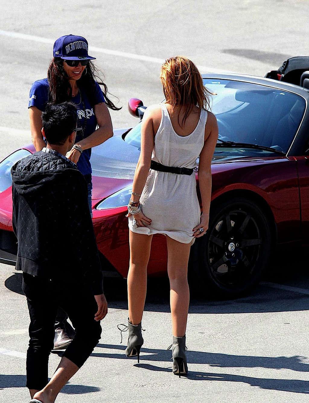 16P Miley Cyrus in thong and see thru dress and almost upskirt