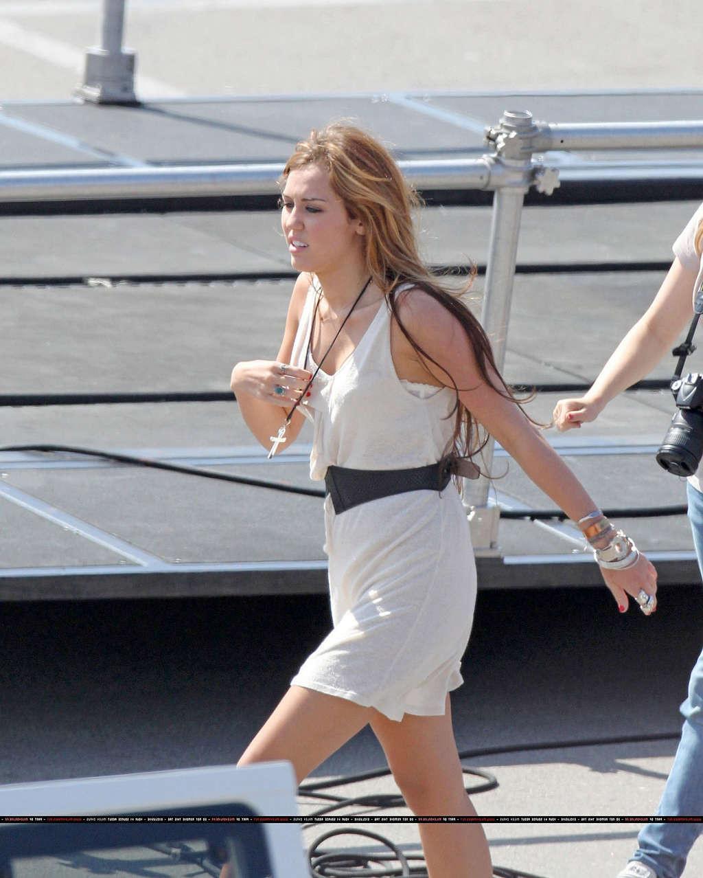 16P Miley Cyrus in thong and see thru dress and almost upskirt