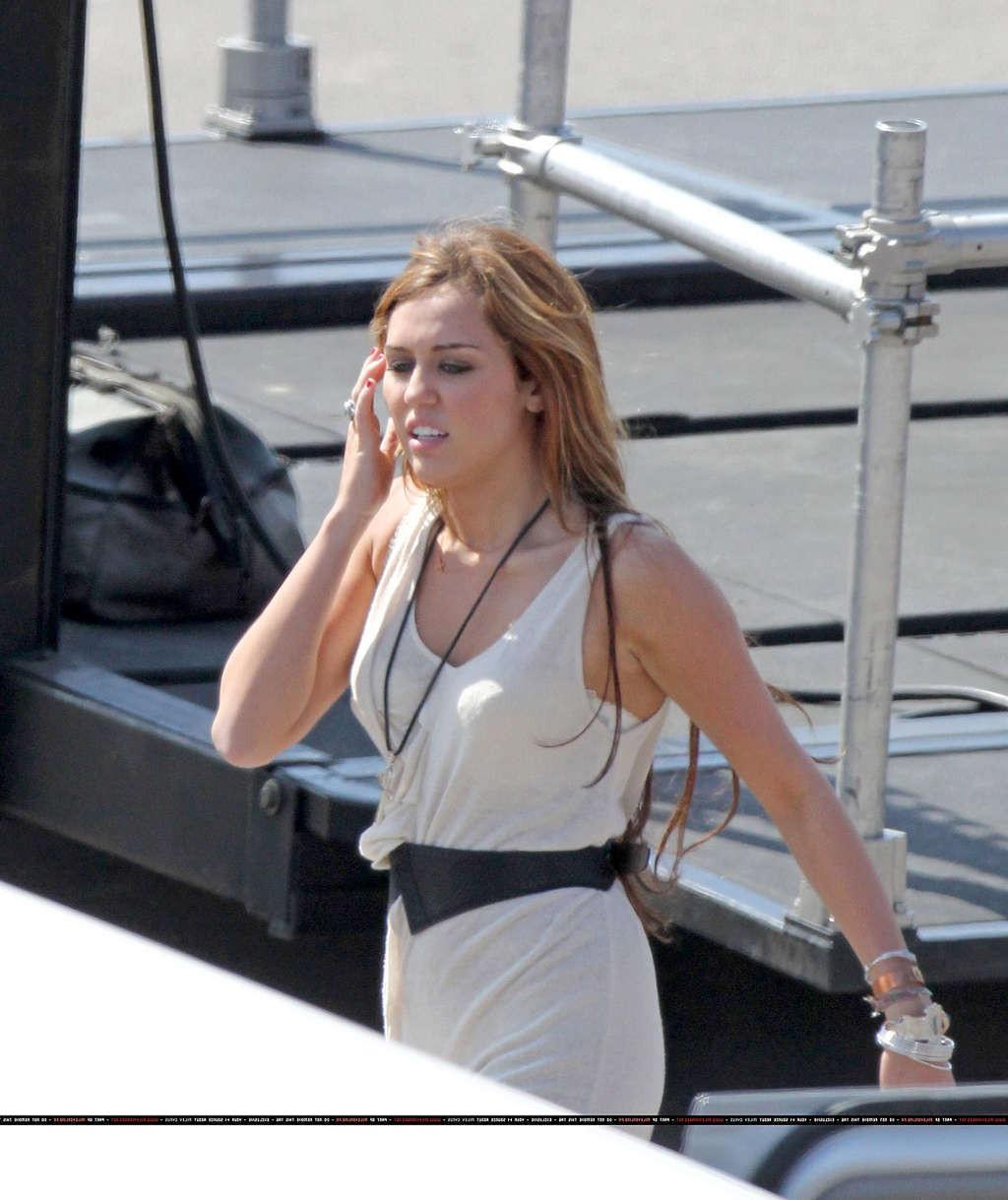 16P Miley Cyrus in thong and see thru dress and almost upskirt