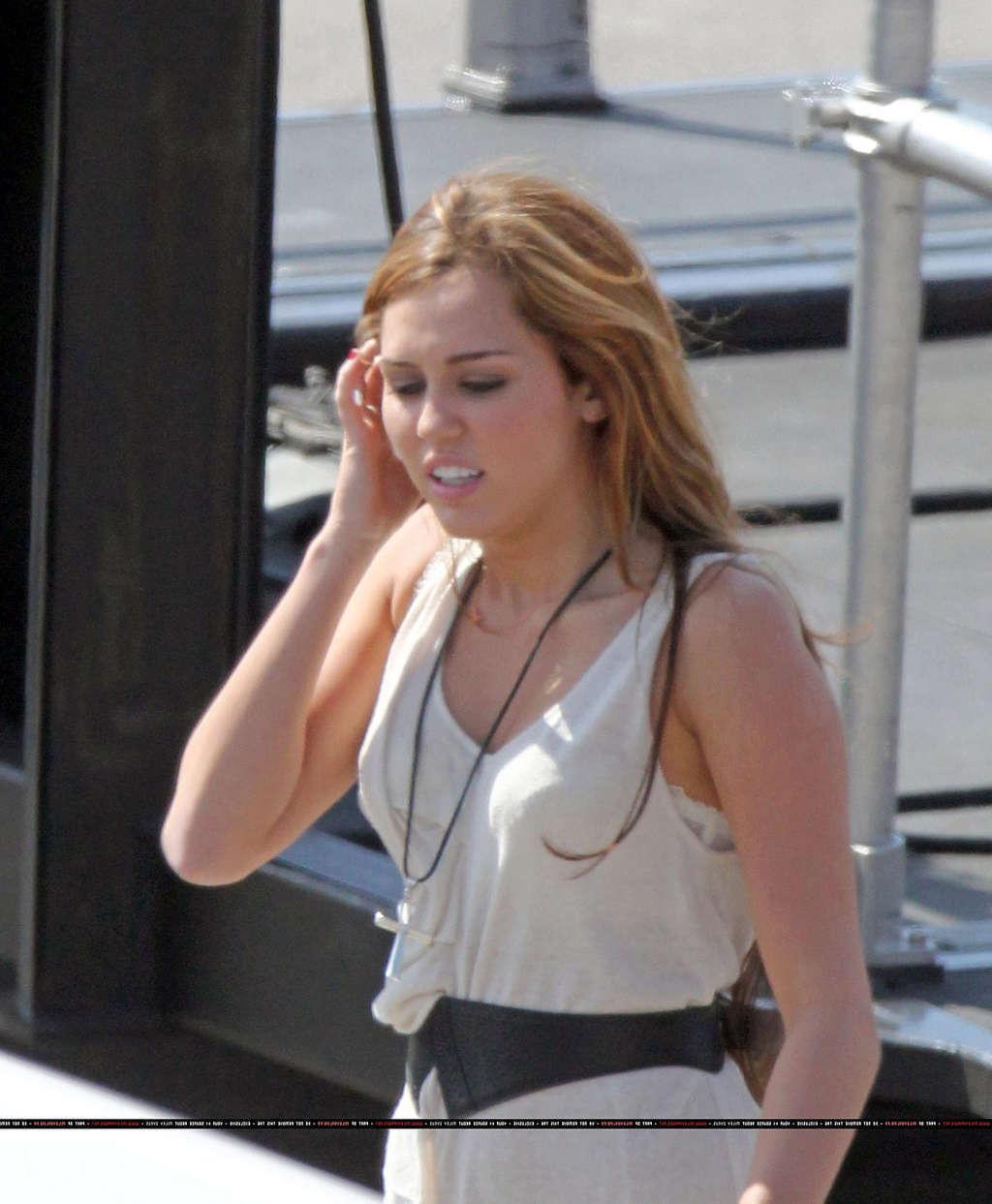16P Miley Cyrus in thong and see thru dress and almost upskirt