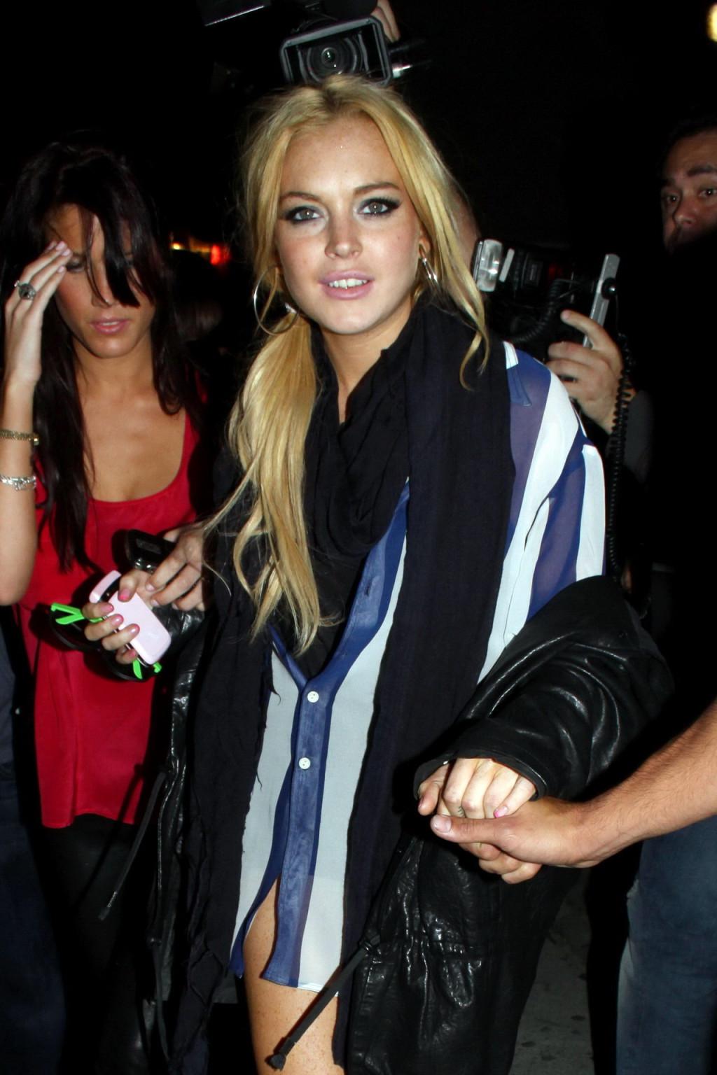 15P Lindsay Lohan leggy  in see-through top leaving her apartment in West Hollywood