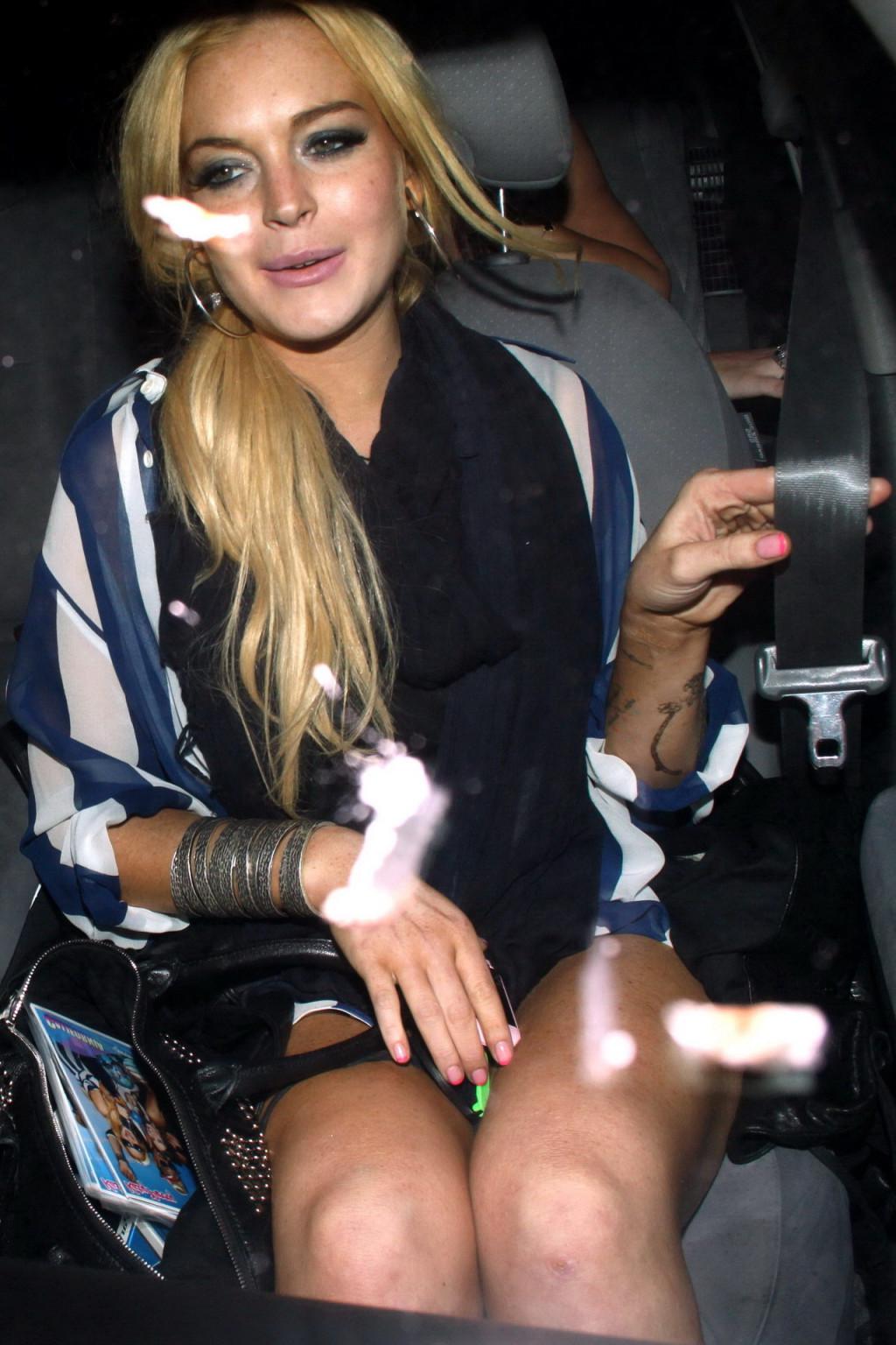 15P Lindsay Lohan leggy  in see-through top leaving her apartment in West Hollywood