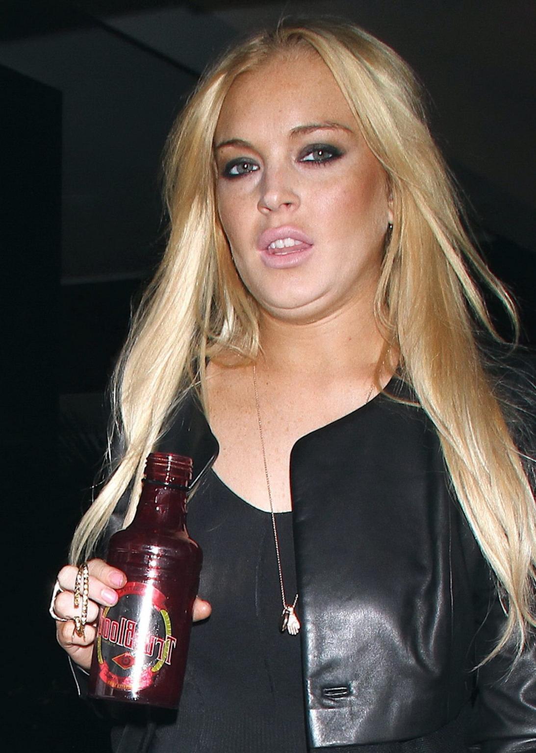15P Lindsay Lohan leggy  in see-through top leaving her apartment in West Hollywood