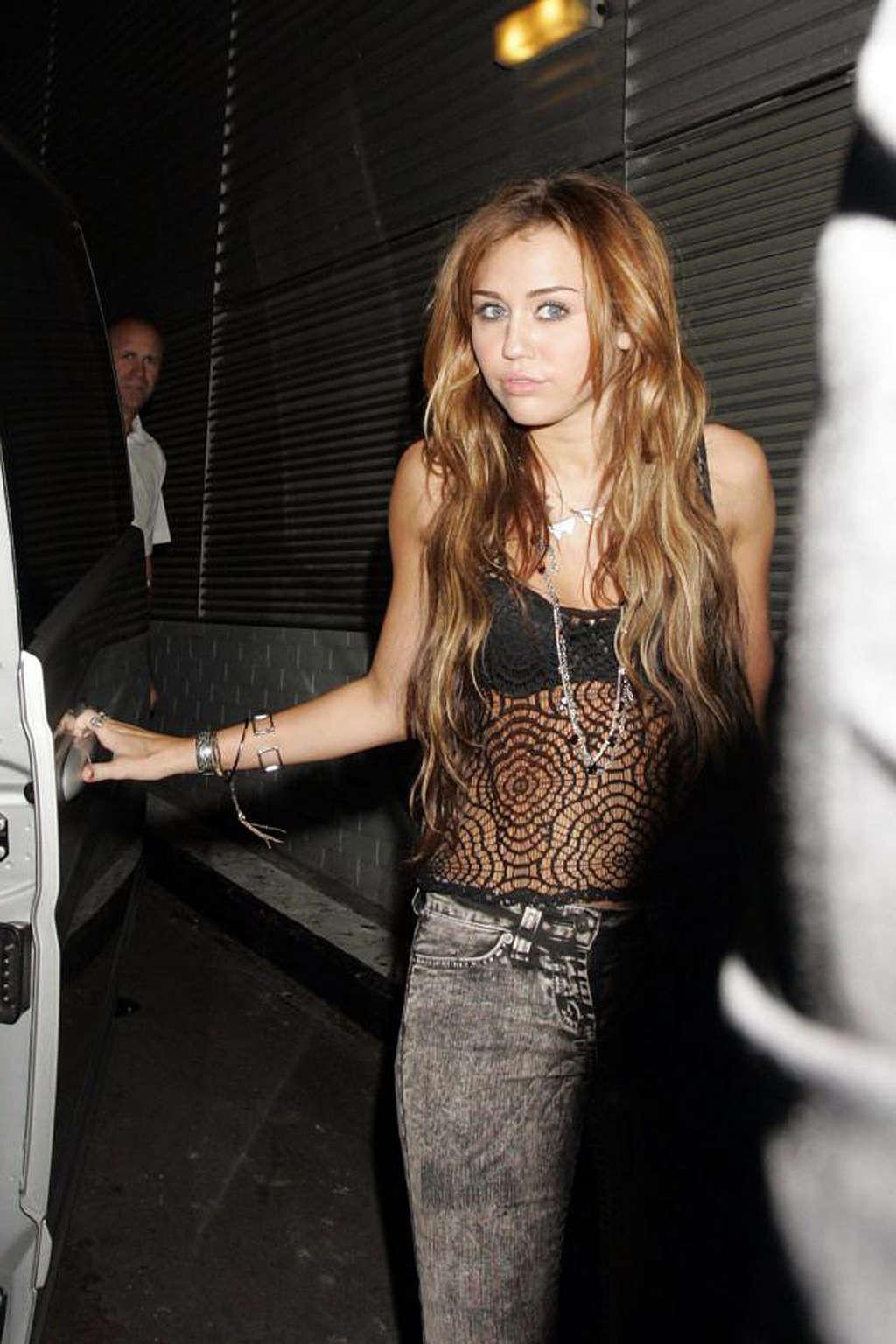 16P Miley Cyrus exposing her fucking sexy body and nice tits in see thru blouse