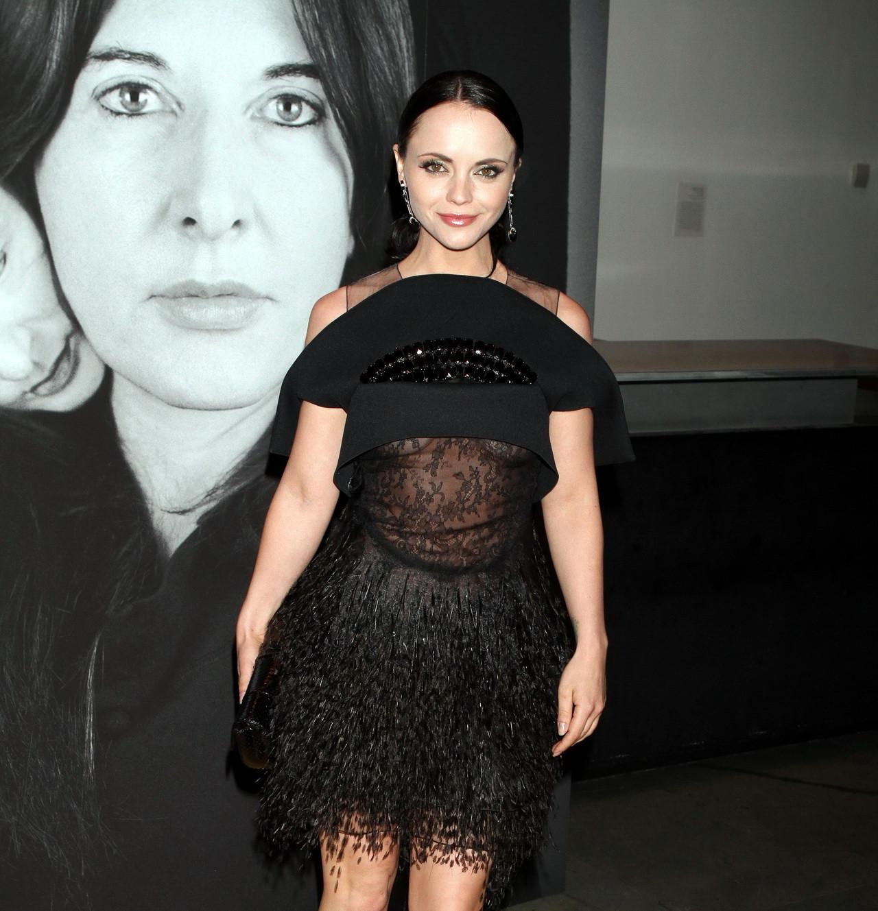 15P Christina Ricci showing under-boobs in see-through dress at 'The Artist is Prese