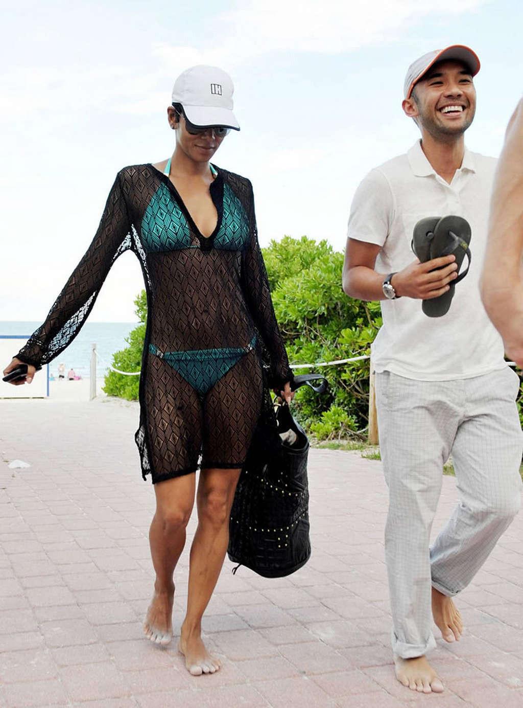 16P Halle Berry exposing her fucking sexy body in see thru dress on beach