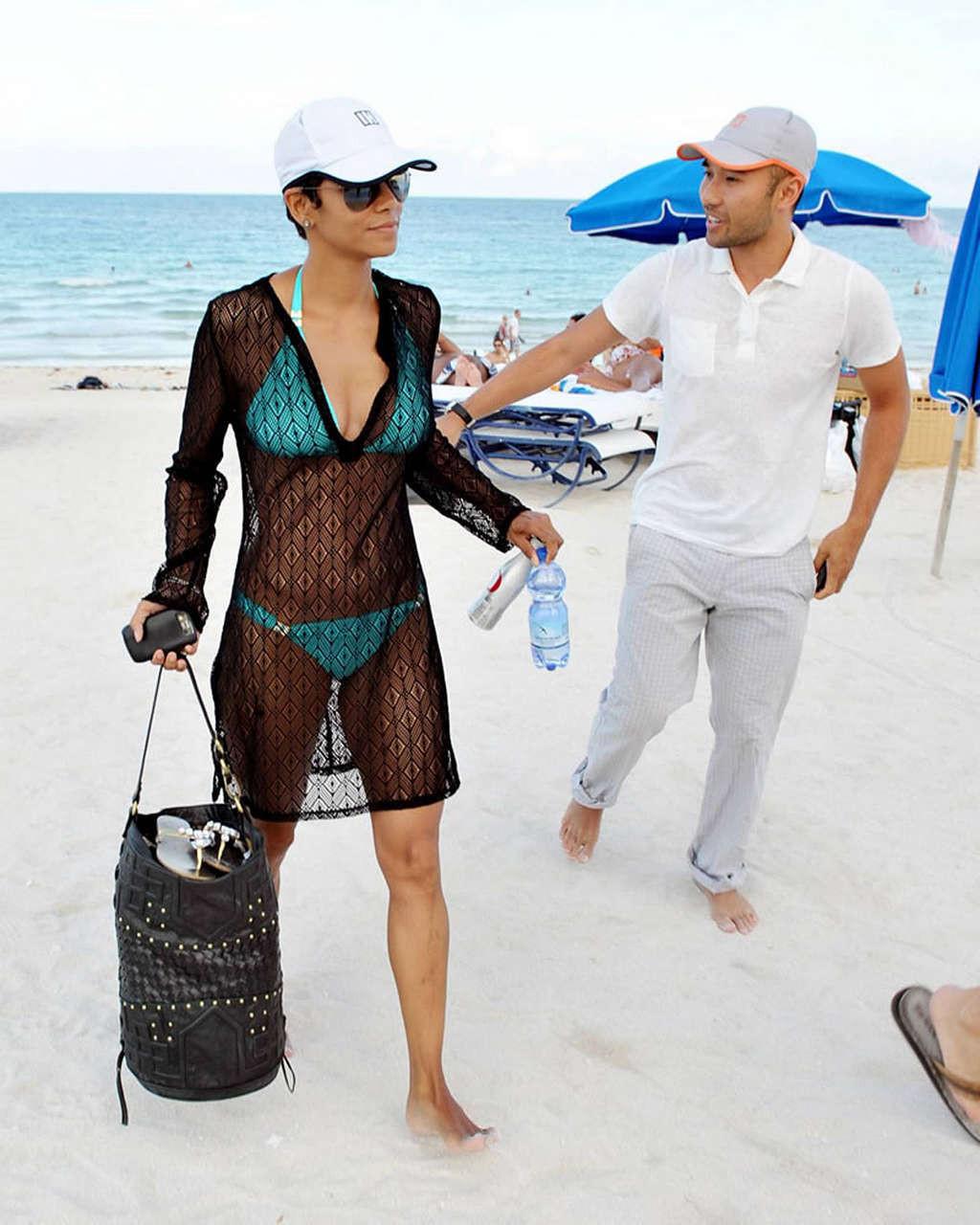 16P Halle Berry exposing her fucking sexy body in see thru dress on beach