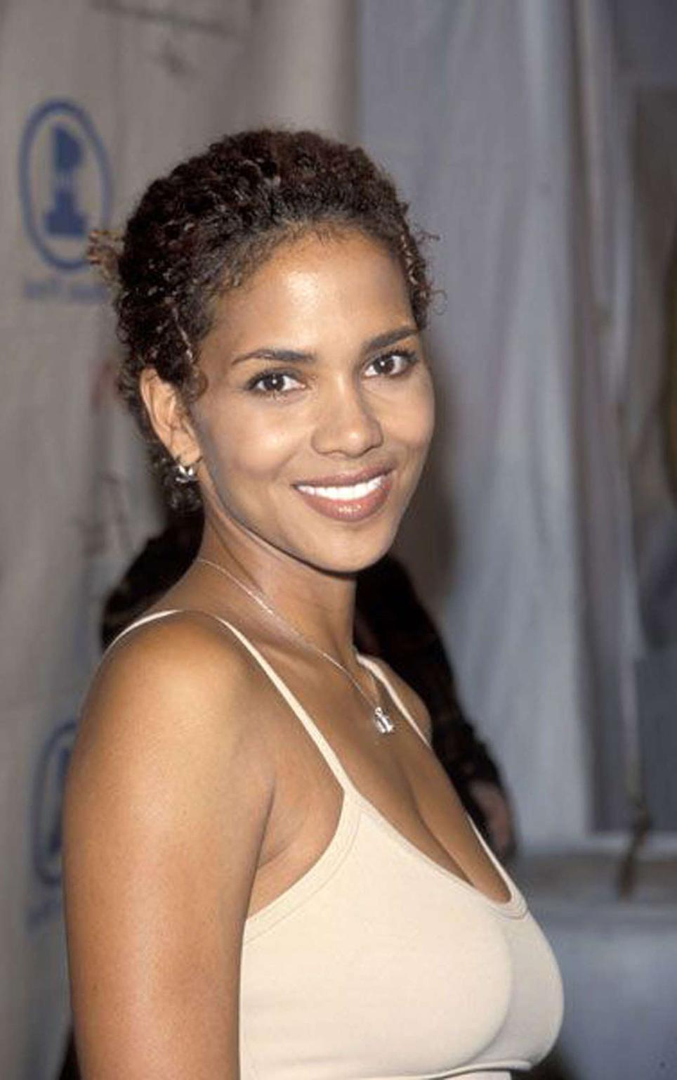16P Halle Berry showing her nice tits and pookies in see thru dress