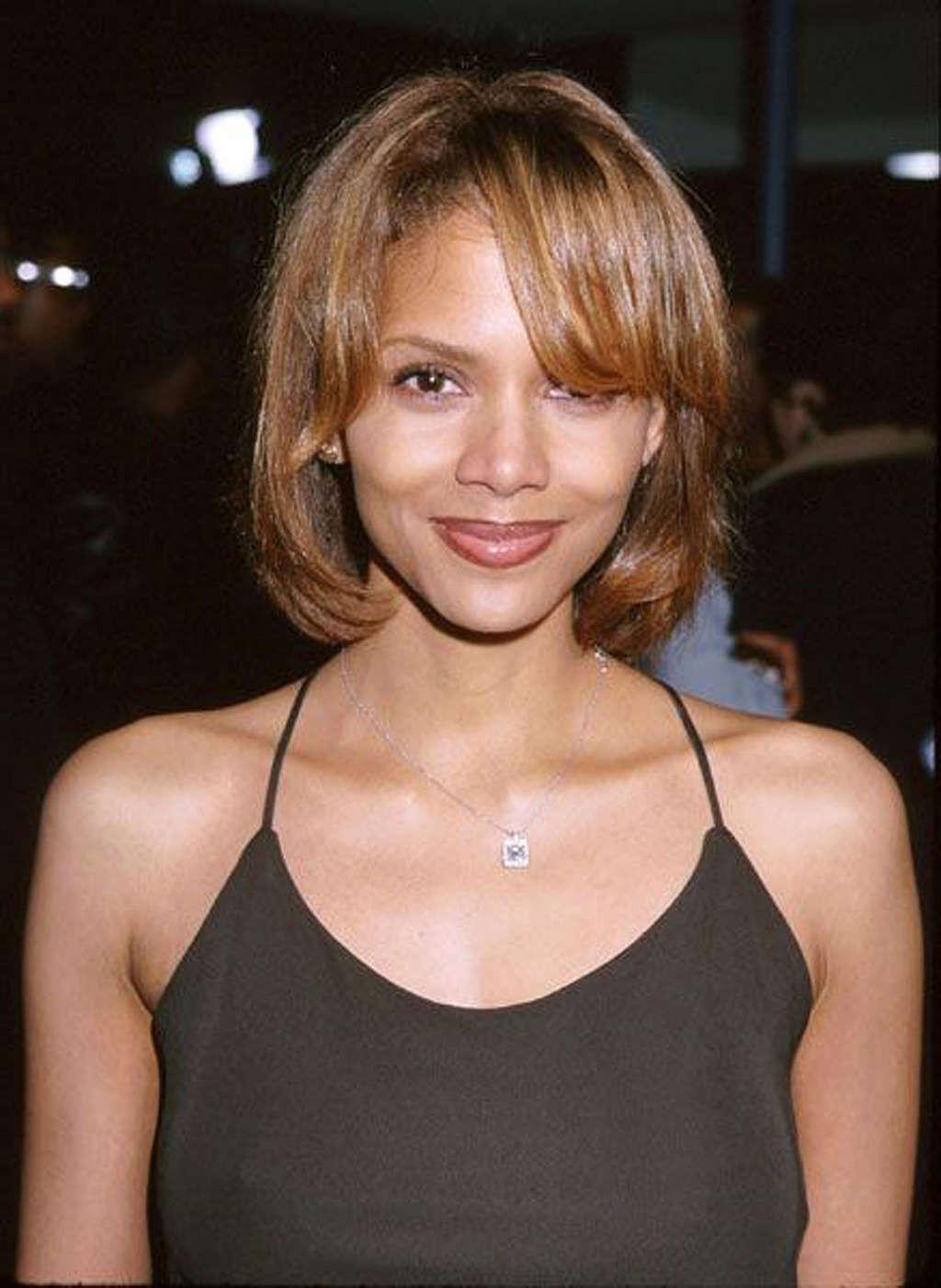 16P Halle Berry showing her nice tits and pookies in see thru dress
