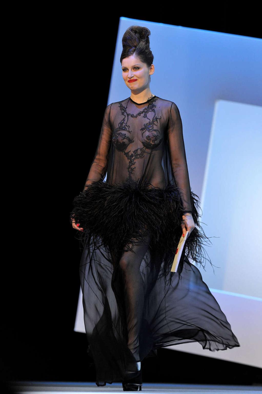 10P Laetitia Casta showing her nice tits and panties in see thru dress paparazzi pic