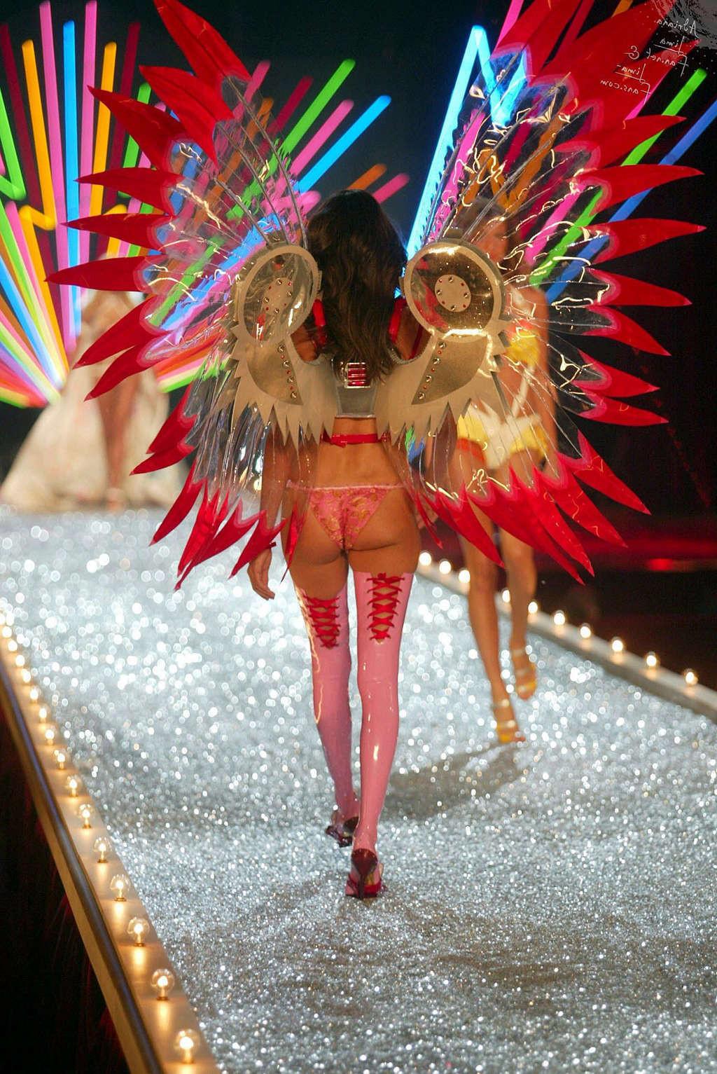10P Adriana Lima showing her nice tits in see thru top and great legs