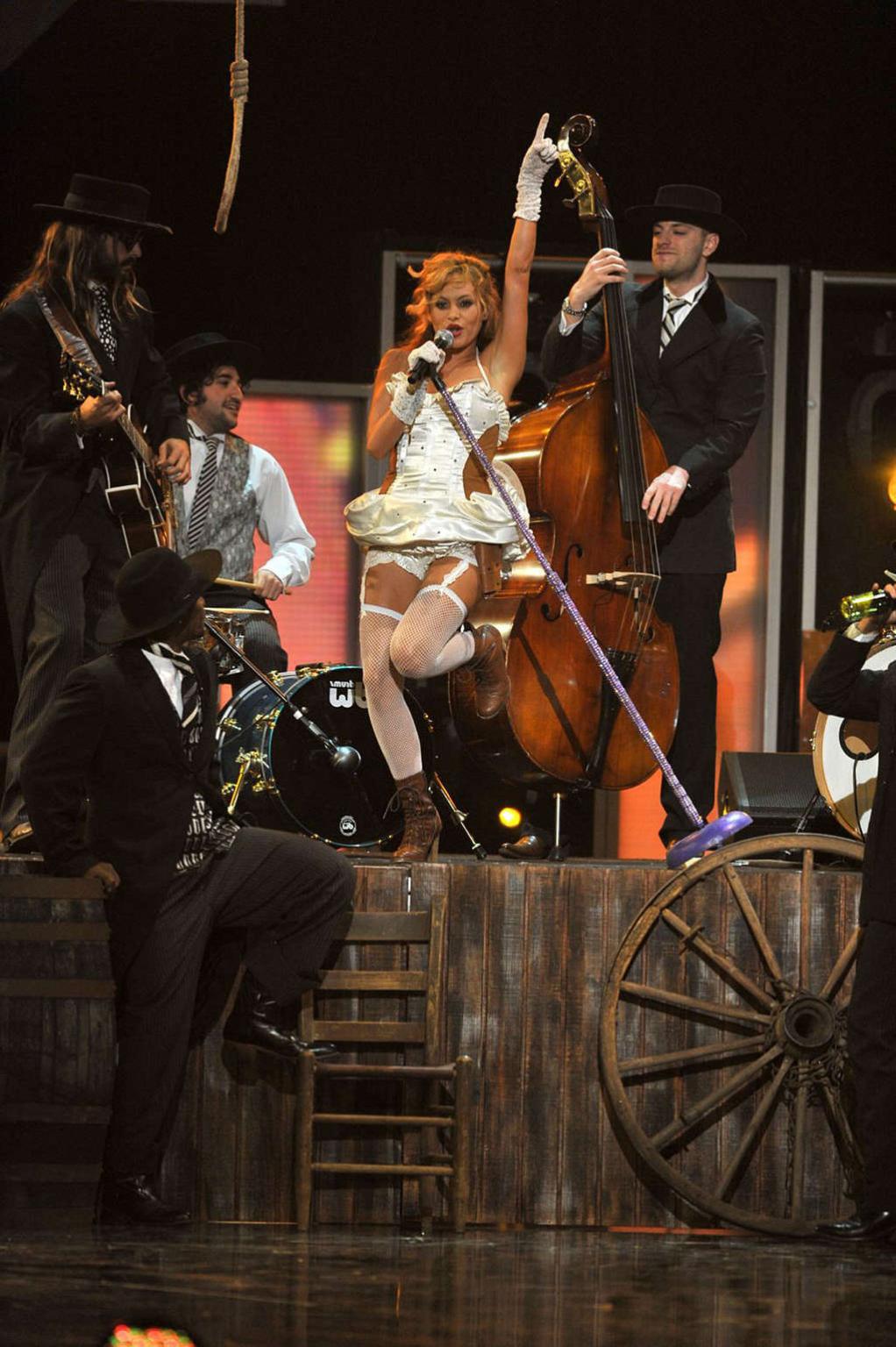 16P Paulina Rubio showing her tits and great ass in see thru