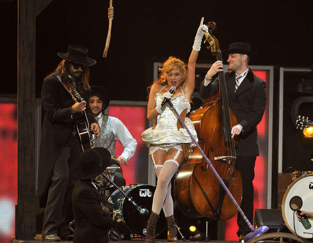 16P Paulina Rubio showing her tits and great ass in see thru