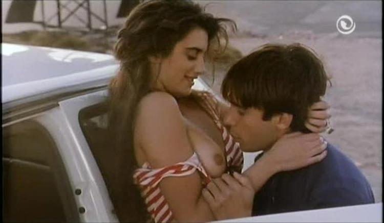 15P Penelope Cruz letting a guy to kiss her boobs