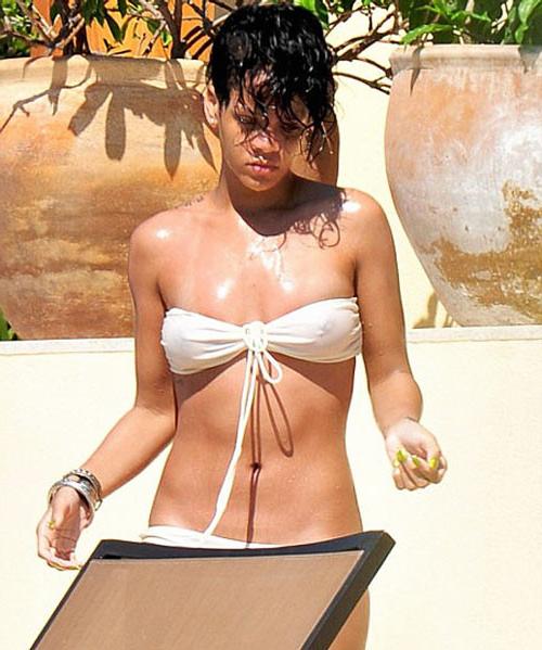 16P Rihanna showing her nice tits in see thru top and great legs in mini skirt