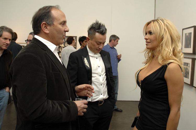 16P Pamela Anderson showing nice big tits in see thru