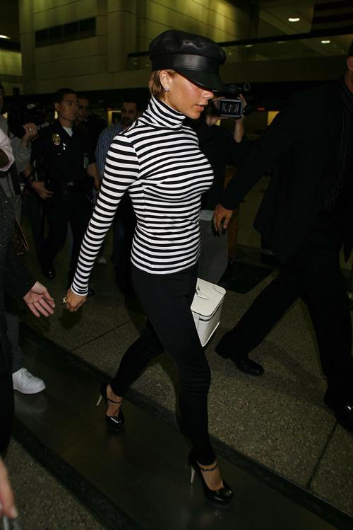 16P Victoria Beckham showing her big tits in see thru and upskirt