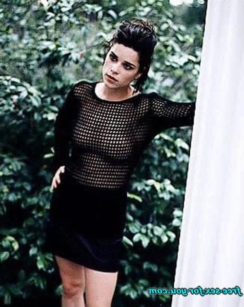 16P Neve Campbell posing sexy in black stockings and see thru dress