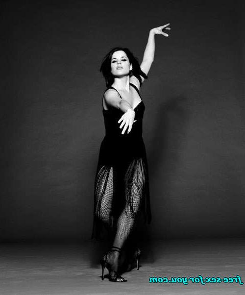 16P Neve Campbell posing sexy in black stockings and see thru dress