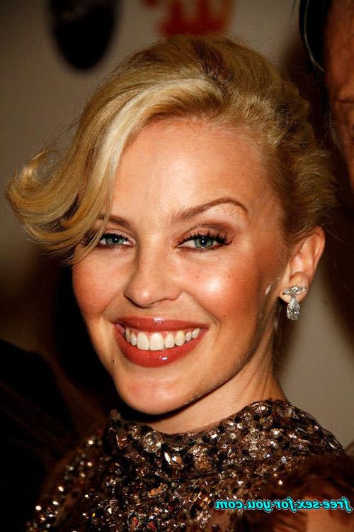 16P Kylie Minogue showing her tits and posing in see thru dress