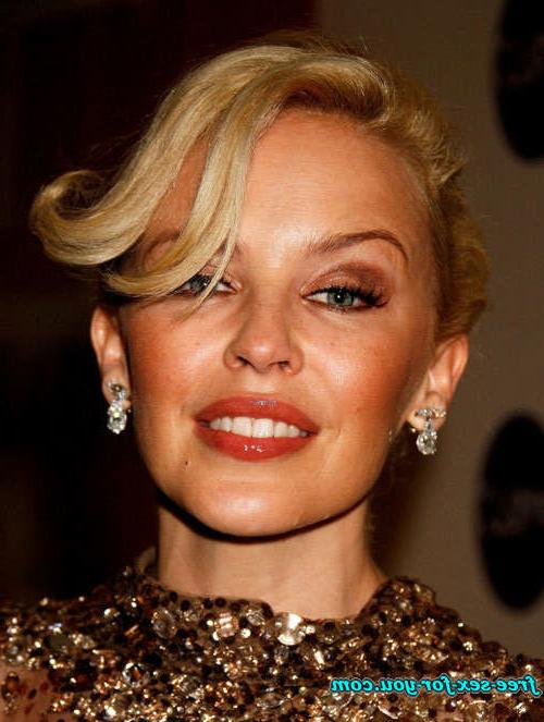 16P Kylie Minogue showing her tits and posing in see thru dress
