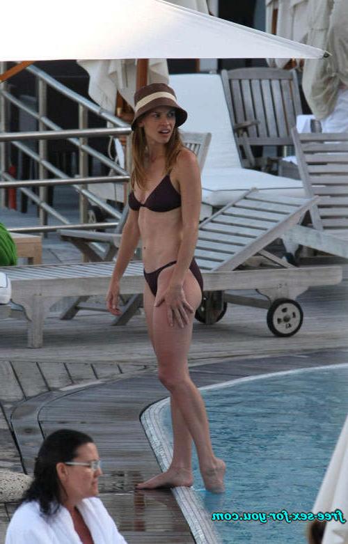 16P Hilary Swank show tits in see thru dress and bikini posing