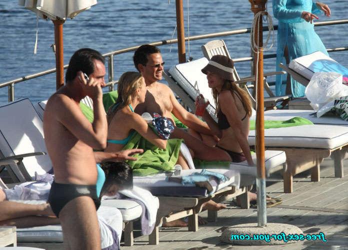 16P Hilary Swank show tits in see thru dress and bikini posing