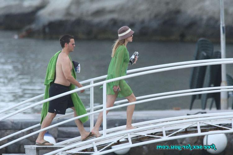 16P Hilary Swank show tits in see thru dress and bikini posing