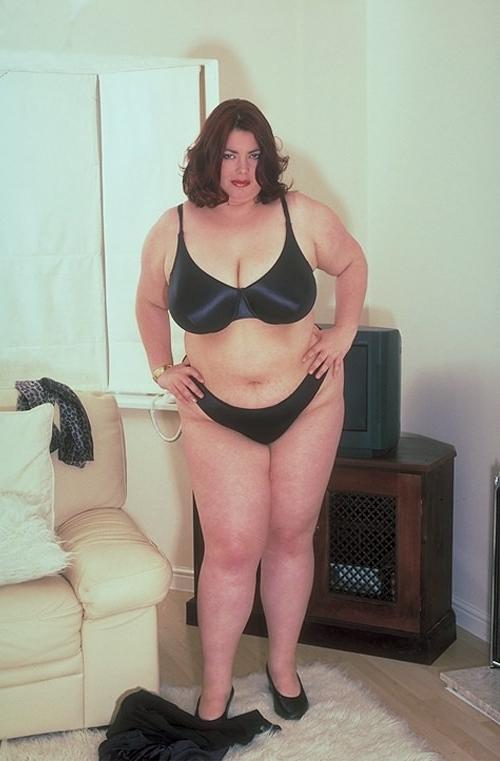 20P Horny mature bbw fondling her huge tits while strip teasing